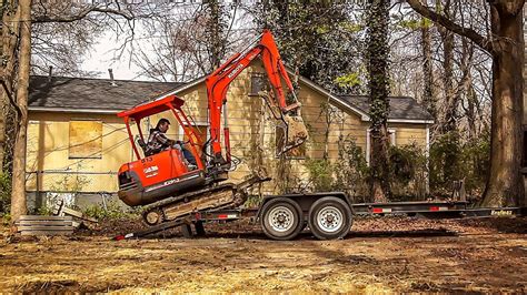 how to load mini excavator on trailer|unloading mini excavator on trailer.